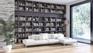 modernt vardagsrum med stor inbyggd bokhylla fylld med böcker
